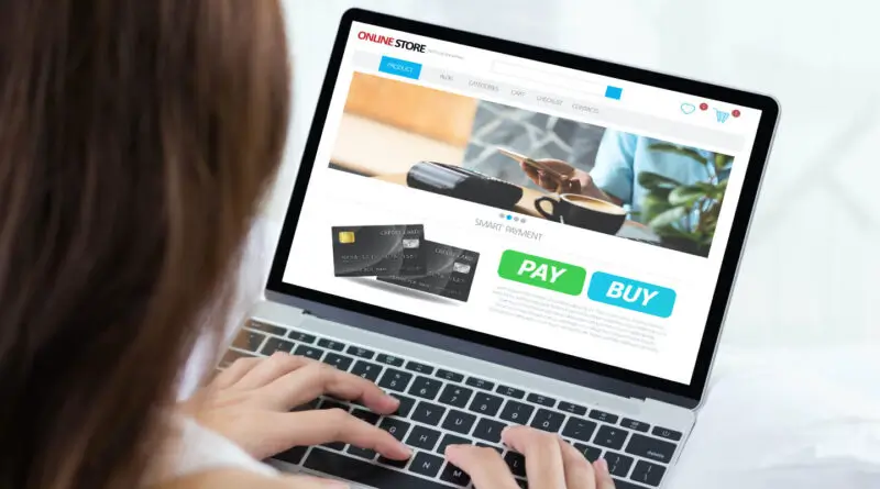 A woman buying something on her laptop using a payment gateway.
